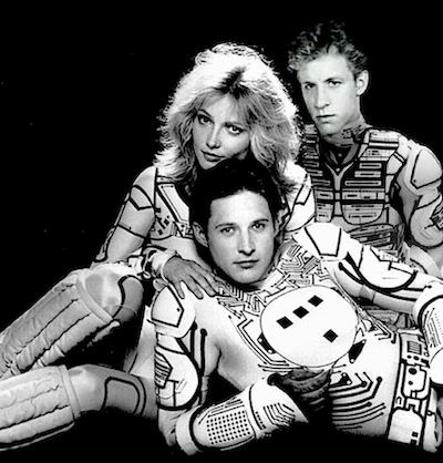 Tron and Ram and Yori posed together (composite created by pasting together a few different black and white promo photos)