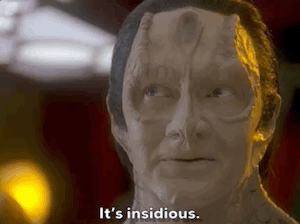 Deep Space 9 close-up of Elim Garak's face, subtitle saying "it's insidious"