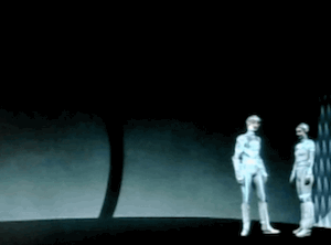 Clip of the cut scene from TRON. Yori has invited Tron into her room, which is extremely plain and empty. She says: It's my quarters. Not like home, is it. We can talk here.
