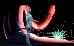 Clip of the cut scene from TRON. Yori undergoes a shimmering glowing transformation from her blue-circuited white bodysuit and cap to a long sparkling cape and uncovered hair.