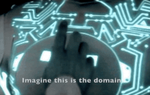 Clip of the cut scene from TRON. Yori begins touching the circuit patterns on his chest, gradually following them downward to his belt, saying: Imagine this is the domain. We're here, and where you want to go can be reached by this circuit. And if we follow it, all the way…