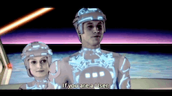 Tron says to Flynn: If you are a User, then everything you've done has been according to a plan, right? Flynn laughs and says, You wish!