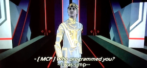screenshot from TRON 1982. Clu 1 has been captured and is being interrogated by the MCP. The MCP asks: Who programmed you? Clu responds: I was simp--