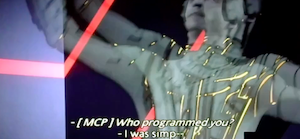 Screenshot of Clu 1 from TRON 1982 being thrown off balance. The subtitles still show the MCP asking: Who programmed you? and Clu responding: I was simp--