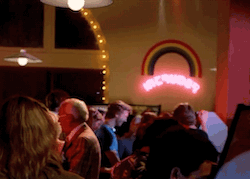 lora and alan finding flynn under the rainbow like a leprechaun on his pot of gold. except he's on a space paranoids machine and the rainbow is a neon sign for another game called "intruder." this may be foreshadowing of how he will be an intruder in the computer world. it may also be a nod to dorothy singing "over the rainbow" prior to her own isekai adventure. in any case it's really gay.