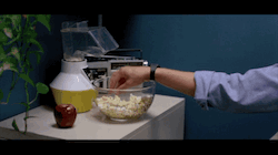 Alan Bradley in Tron (1982) eats a handful of popcorn just as his computer displays the message  "address file empty, Tron program unavailable."