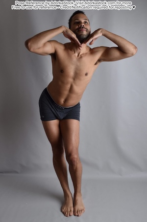 A dark skinned latino man standing contrapposto, hands against his chin as he looks up towards the right.
