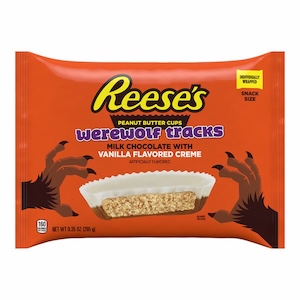 A bag of werewolf track's reese's peanut butter cups on a white background. the reese's are half milk chocolate and half vanilla flavored creme, which makes them half white.