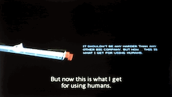 scene from original 1982 Tron movie. the MCP's screen showing a rotating diagram, then cutting to Dillinger's face as the closed-captioning says: But now this is what I get for using humans.