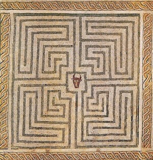 a mosaic depicting the bull-like head of the Minotaur at the center of the Labyrinth, which is shown as a single non-branching path that folds in on itself extensively.